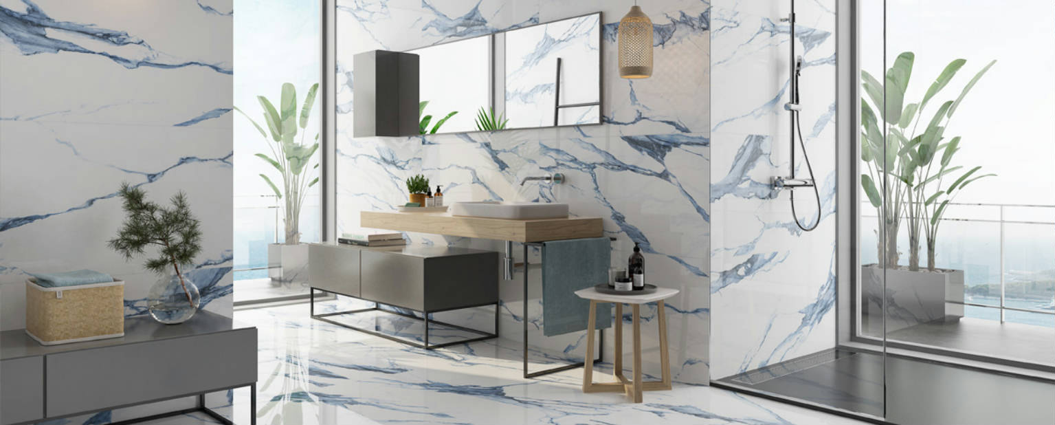 Bathroom with blue-veined marble-look tile flooring