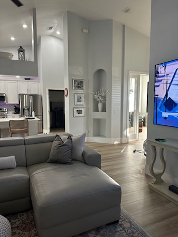 Living room with well-maintained wood-look flooring